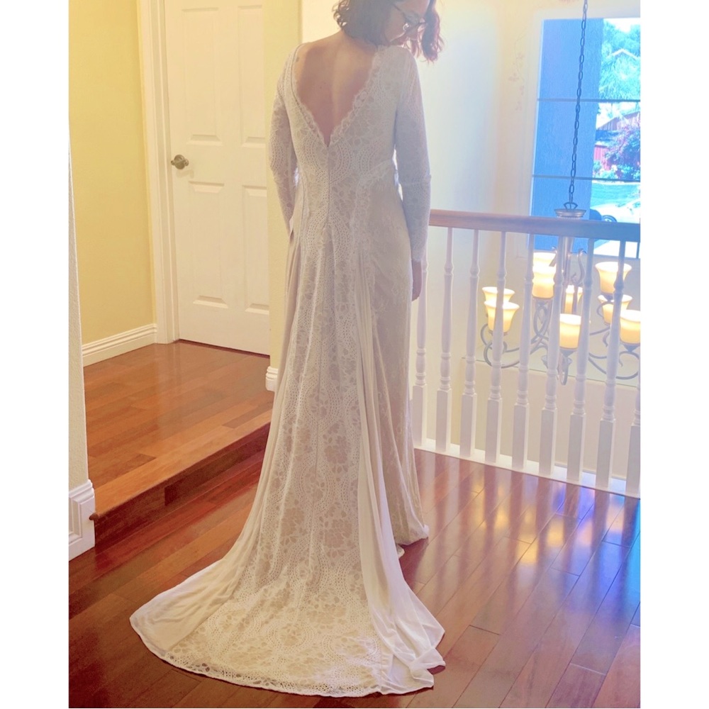 Long sleeved lace wedding dress